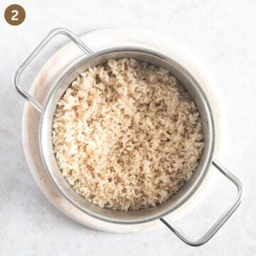 cooked brown rice in a small pot.