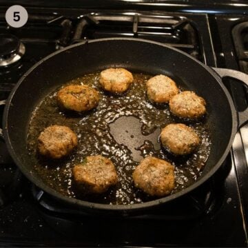 frying shrimp and sweet potato cakes in a large pan.