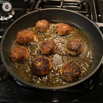 frying sweet potato cakes with shrimp in a apn.