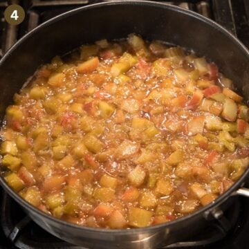 simmering rhubarb for making compote in a saucepan.