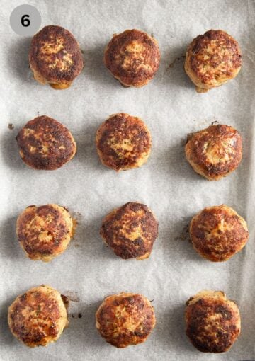 baked turkey meatballs on a baking sheet lined with parchment paper.
