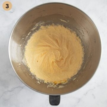 beaten eggs, sugar, and butter to make cake batter in a bowl.