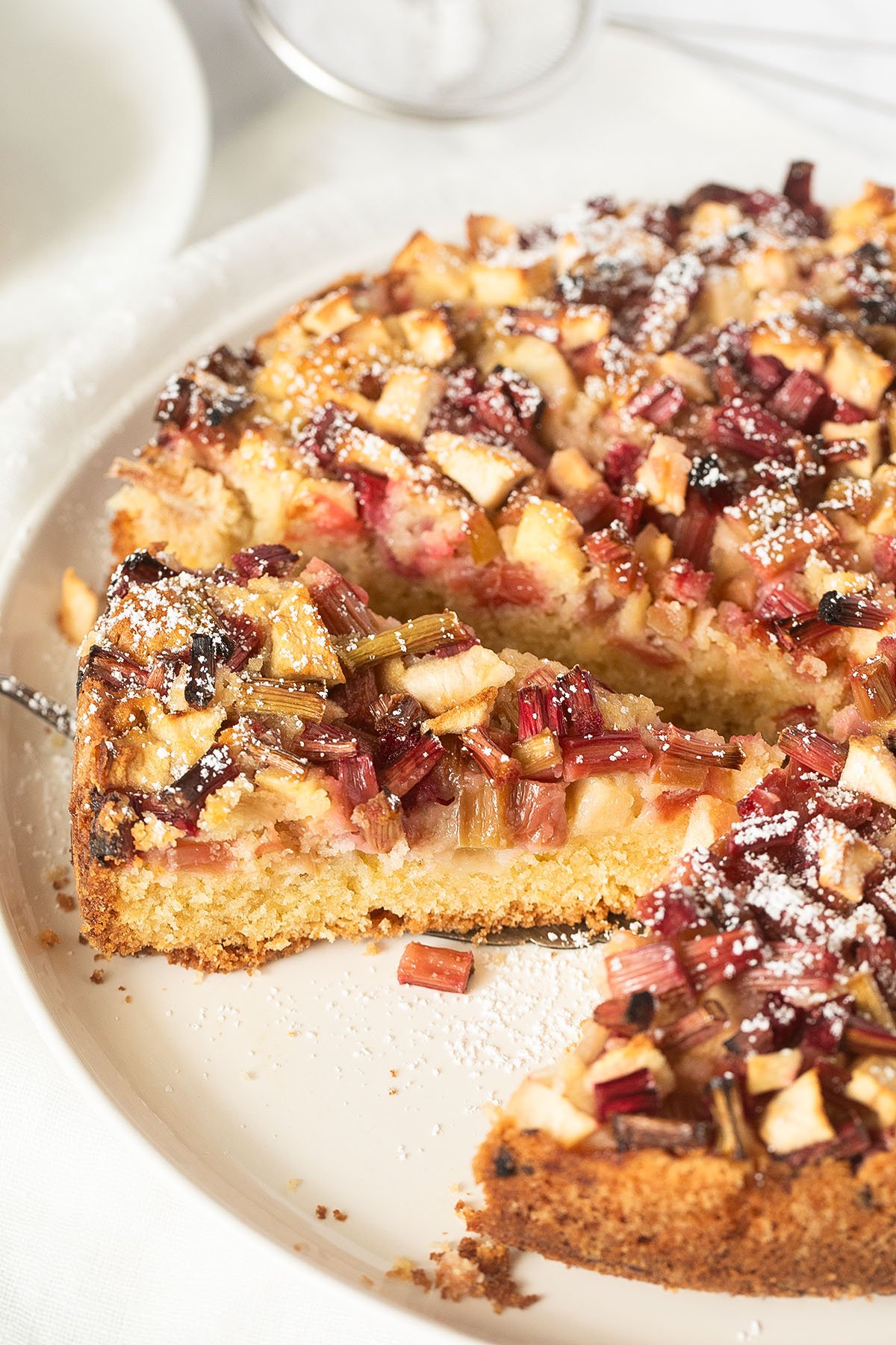 sliced rhubarb and apple cake on a plater.