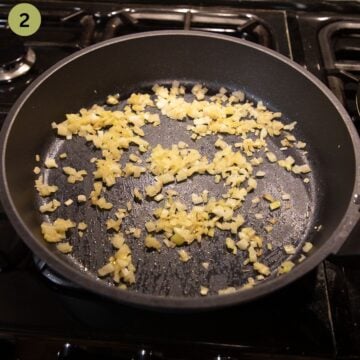 sauteing diced onions in a pan.