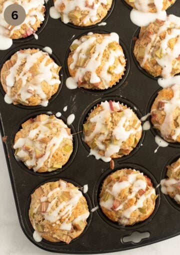 baked and glazed muffins in a muffin pan.
