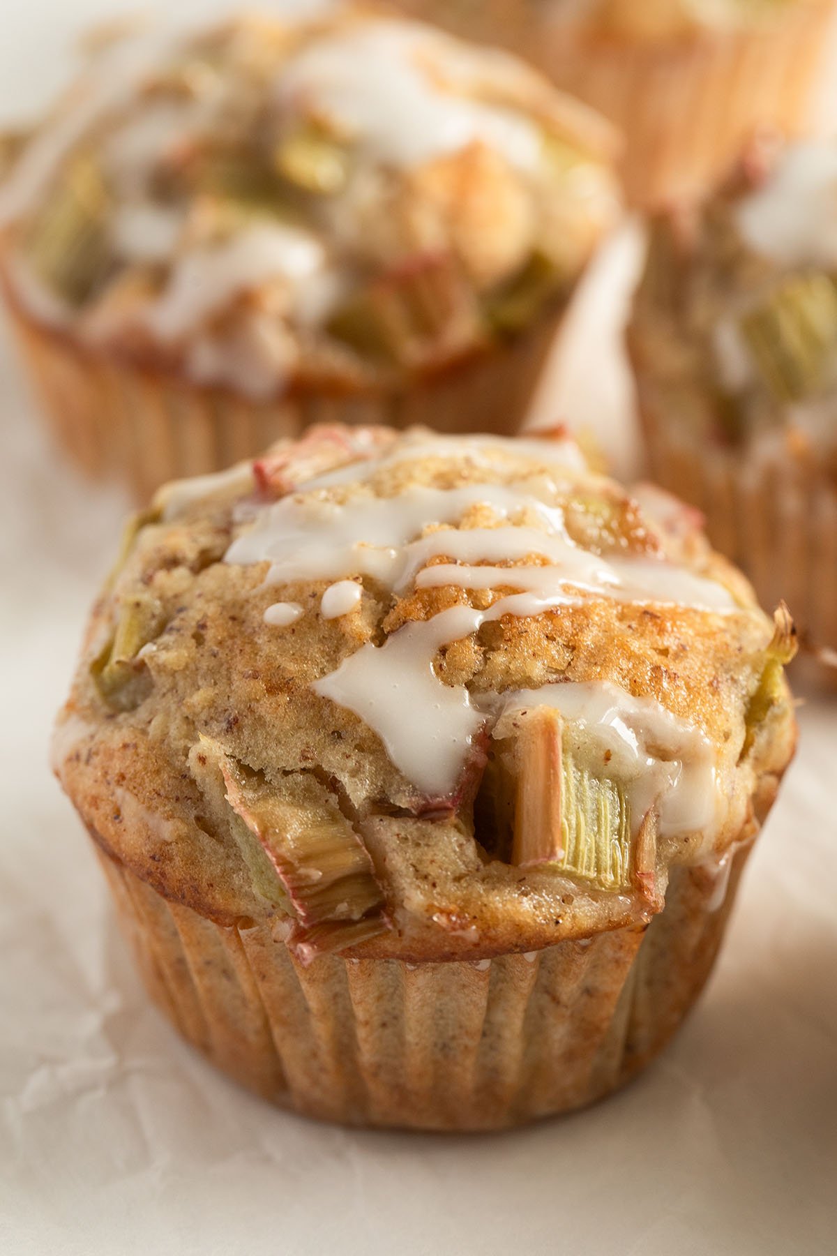banana and rhubarb muffins glazed with lemon glaze.