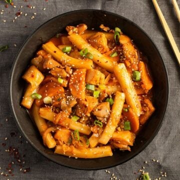 chicken rice cake stir fry in a bowl.