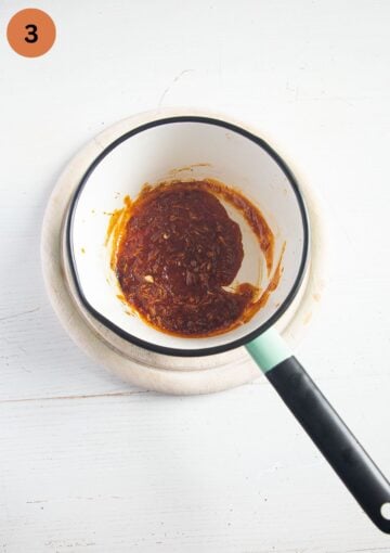 reduced gochujang glaze in a saucepan.