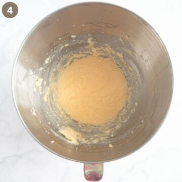 creamed butter, sugar and eggs for making cake in a bowl.