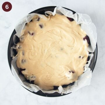 unbaked cherry cake with the batter on top and the cherries under it.