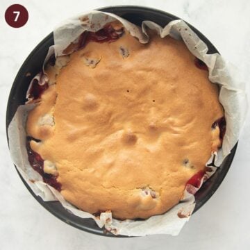 baked cherry cake in a lined springform.