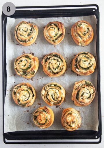 baked feta rolls with spinach on a baking sheet.