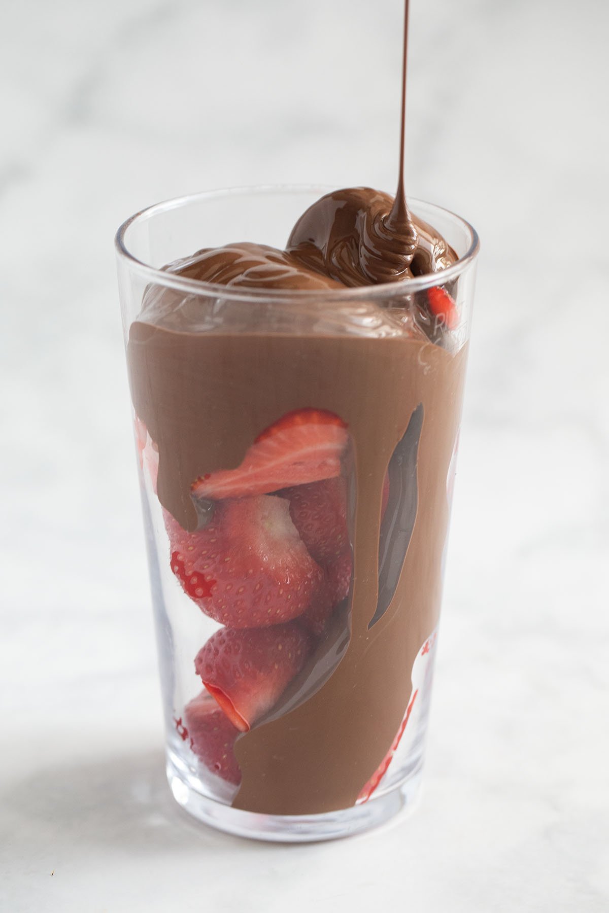 london chocolate strawberries in a tall glass.