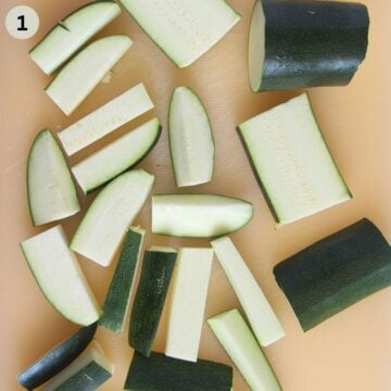 cutting zucchini into sticks on a cutting board.