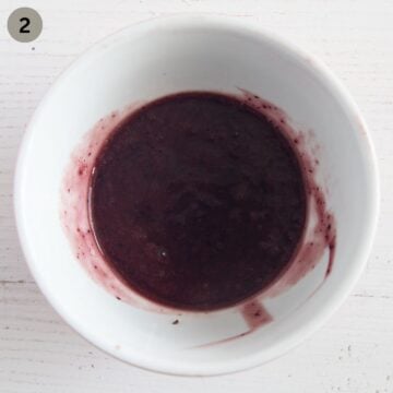 fresh blueberry sauce for panna cotta in a small bowl.