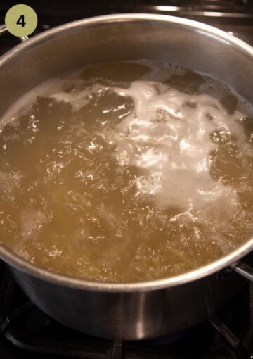 pasta in boiling water in a large pot.