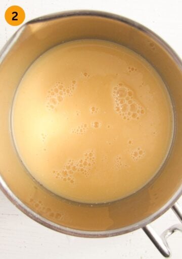 mixture of orange juice, buttermilk and honey for making popsicles in a large bowl.