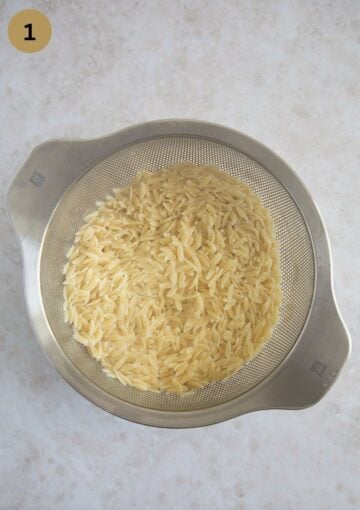drained cooked orzo in a sieve.