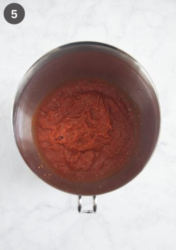 blended tomato sauce in a large, metal bowl.