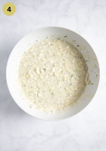 mixture of zucchini flesh, feta, cream, and eggs for stuffing zucchini halves.