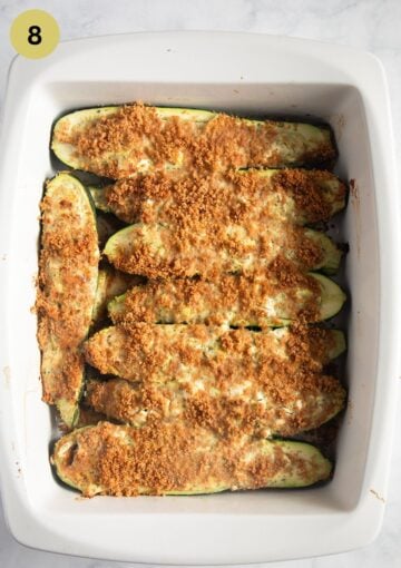baking dish containing stuffed zucchini with feta.