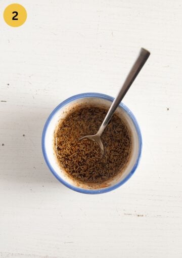 mixed olive oil with rosemary, salt, pepper, paprika, and garlic powder in a small ramekin dish.