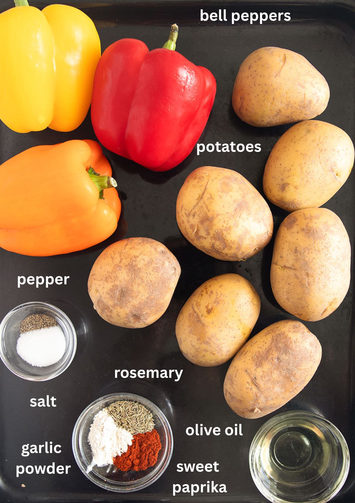 labeled ingredients for roasting peppers and potatoes, with olive oil and seasoning.