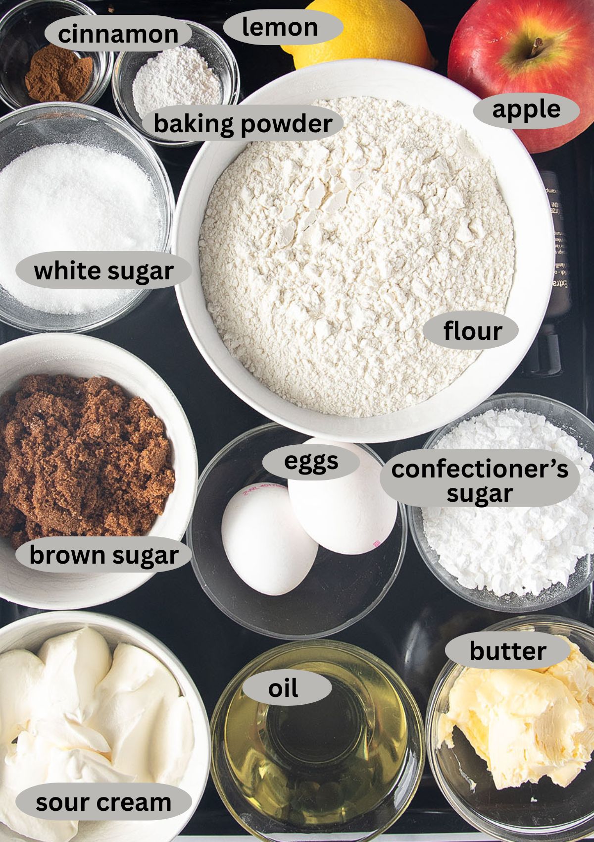 labeled ingredients for making apple muffins with streusel topping.