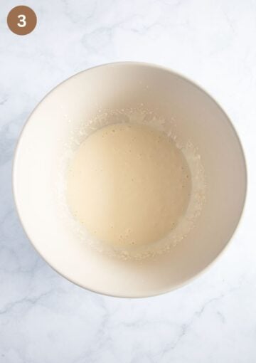 egg and sour cream mixture for making muffin batter in a bowl.