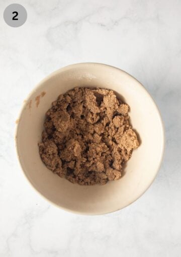 streusel with brown sugar for muffins in a small bowl.