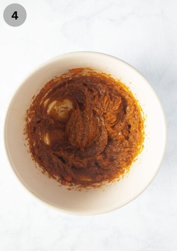 batter for pumpkin muffins in a large bowl.