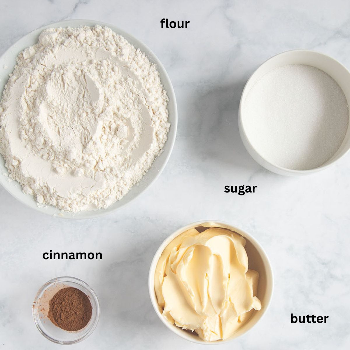 labeled ingredients for making shortbread with flour, cinnamon, butter, and sugar.
