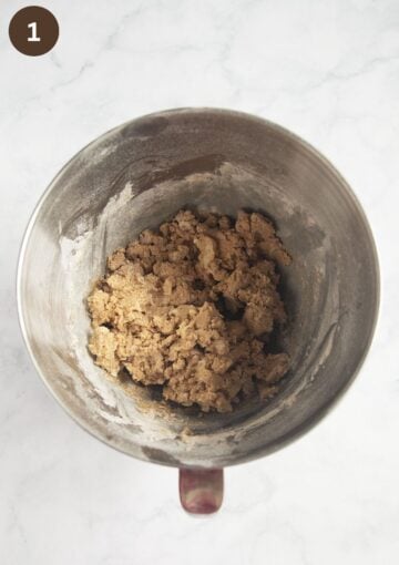shortbread dough mixed in a large metal bowl.