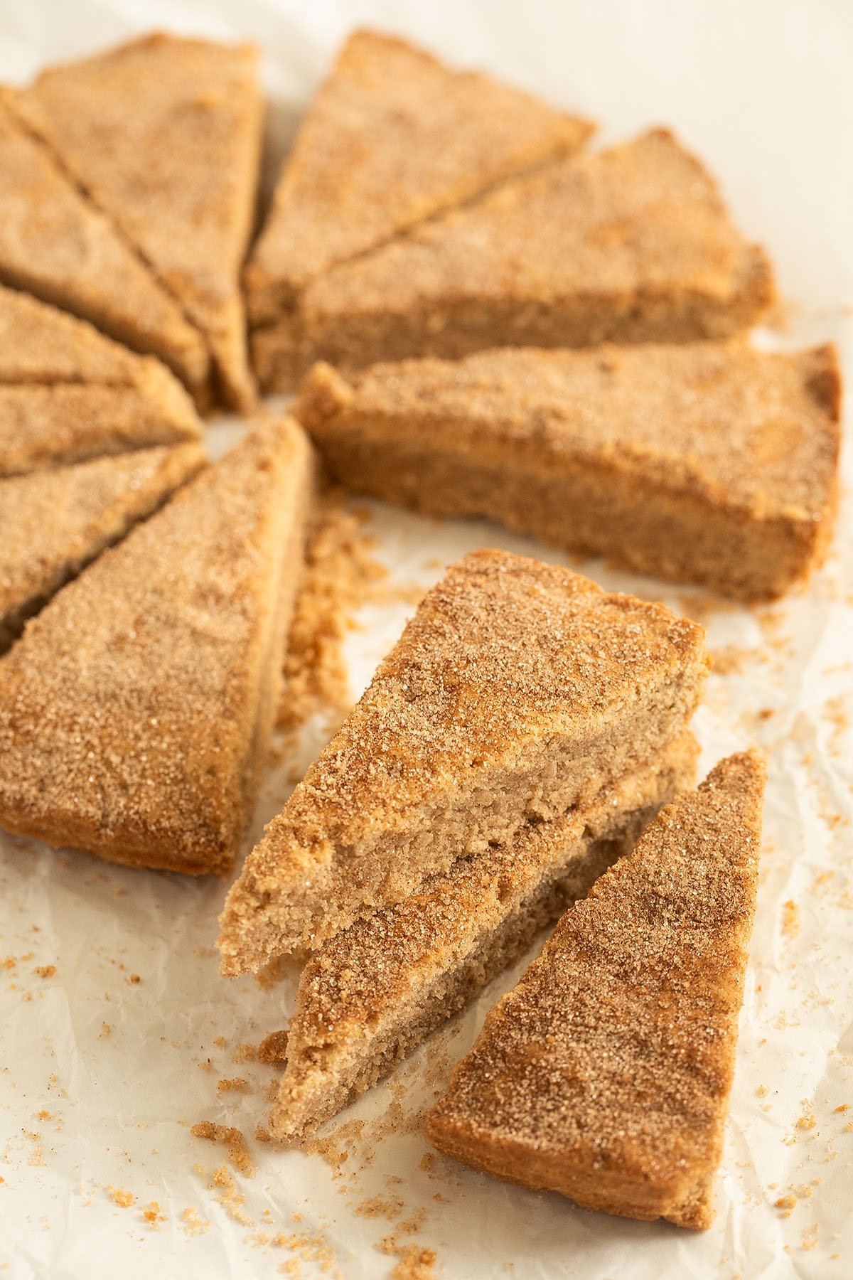 sliced cinnamon shortbread, three slices in front of the rest.