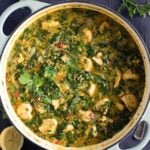 chicken lentil curry with spinach in a large dutch oven.