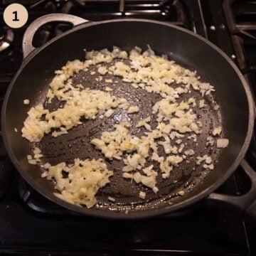 sauteing onions and garlic in a frying pan to make sauce for pasta bake with broccoli and tuna.