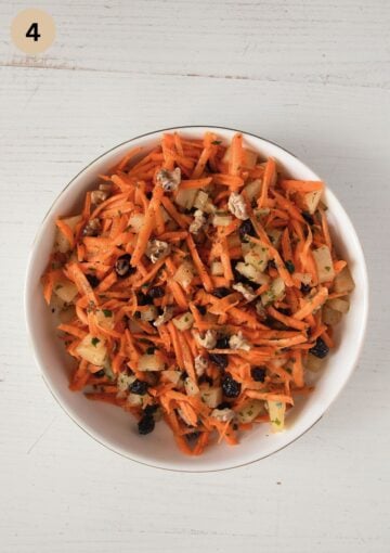 mixed carrots with pineapple pieces, raisins, and toasted walnuts.