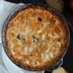 golden-baked irish apple pie in a pie dish.