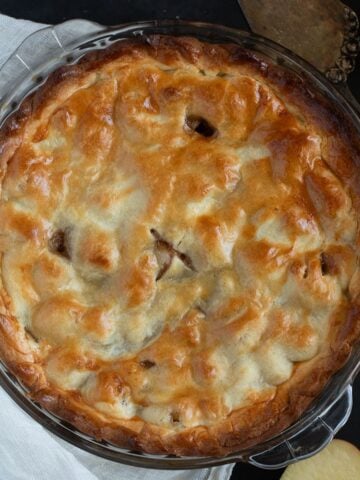 golden-baked irish apple pie in a pie dish.