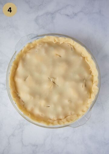 unbaked apple pie in a pie dish.
