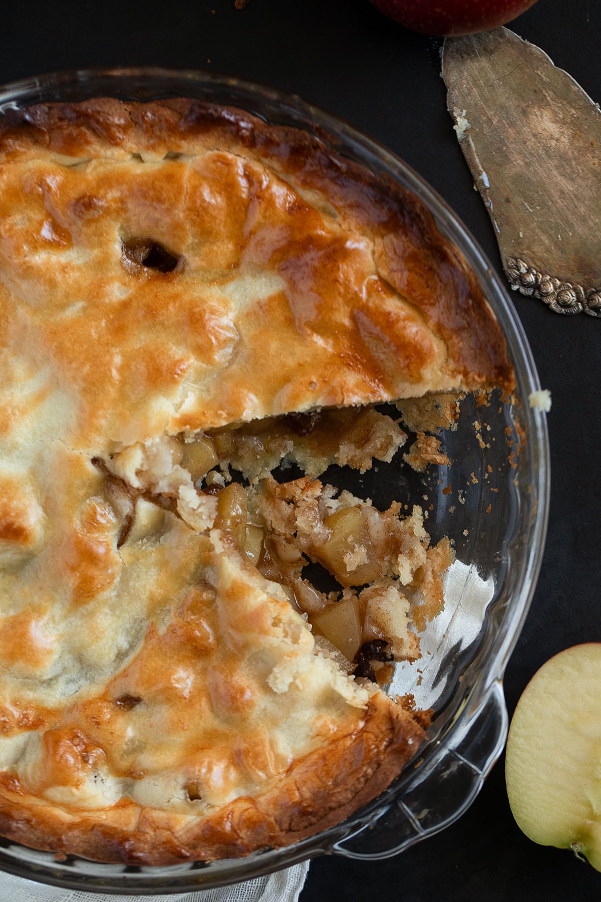 irish apple pie showing the apple and raisin filling in a pie dish.