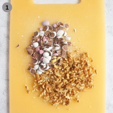 chopped mini eggs and walnuts on a cutting board.