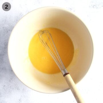 whisking melted butter and egg in a bowl.