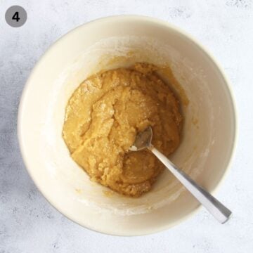 mixing cookie bar dough in a bowl.