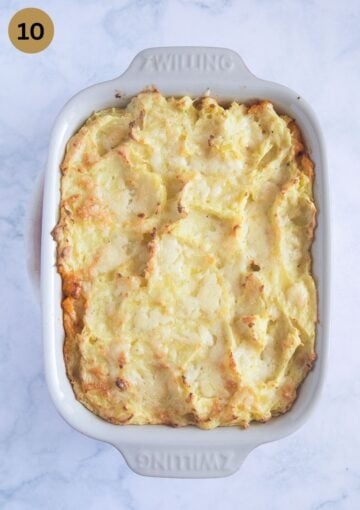 baked shepherd's pie with golden mashed potatoes in a baking dish.