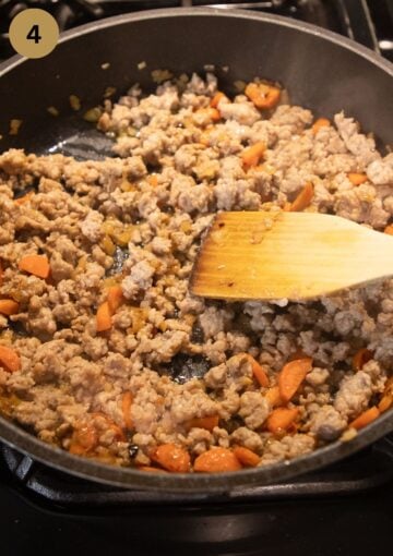 browning ground pork and stirring it with a wooden spoon in a skillet.
