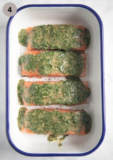 unbaked mustard dill salmon fillets in a roasting pan.