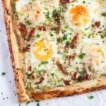 puff pastry egg tarts with pesto and sun-dried tomatoes.