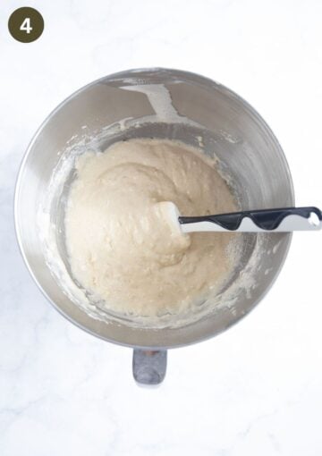 folding flour and baking powder into cake batter with a rubber spatula.