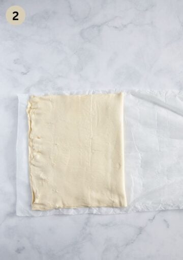 folded puff pastry sheet to cover the cream cheese filling.